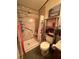 Bathroom features a shower with a grab bar and updated vanity at 4914 Dove Ln, Auburndale, FL 33823
