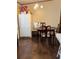 Dining area with wood-look flooring and a wood table with four chairs at 4914 Dove Ln, Auburndale, FL 33823