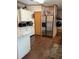 Kitchen features stainless steel appliances and wood-look flooring at 4914 Dove Ln, Auburndale, FL 33823