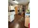 View of kitchen with stainless steel appliances and wood-look flooring at 4914 Dove Ln, Auburndale, FL 33823