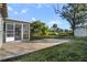 Backyard with patio, shed, and grassy area at 527 Sunrise Dr, Orlando, FL 32803