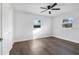 Bright bedroom with wood-look floors and ceiling fan at 527 Sunrise Dr, Orlando, FL 32803