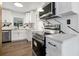 Modern kitchen with stainless steel appliances and marble backsplash at 527 Sunrise Dr, Orlando, FL 32803