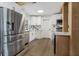 Modern kitchen with white cabinets and stainless steel appliances at 527 Sunrise Dr, Orlando, FL 32803