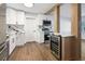 Modern kitchen with white cabinets, marble countertops, and wine cooler at 527 Sunrise Dr, Orlando, FL 32803