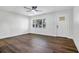 Bright and airy living room with hardwood floors and large windows at 527 Sunrise Dr, Orlando, FL 32803