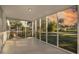 Screened porch overlooking backyard with sunset views at 527 Sunrise Dr, Orlando, FL 32803