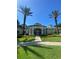 Community clubhouse with landscaping and a paved walkway at 8910 Legacy Ct # 206, Kissimmee, FL 34747