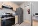 Kitchen with light cabinets, stainless steel appliances and laundry closet at 8910 Legacy Ct # 206, Kissimmee, FL 34747