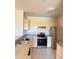 Kitchen with light cabinets, stainless steel appliances and breakfast bar at 8910 Legacy Ct # 206, Kissimmee, FL 34747