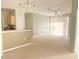Spacious living room with carpet, light walls and sliding glass doors at 8910 Legacy Ct # 206, Kissimmee, FL 34747