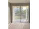 Living room with sliding doors leading to a private balcony at 8910 Legacy Ct # 206, Kissimmee, FL 34747