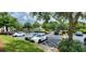 Condo community parking lot with cars at 8910 Legacy Ct # 206, Kissimmee, FL 34747