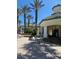 Community pool area with tables, umbrellas, and a snack bar at 8910 Legacy Ct # 206, Kissimmee, FL 34747