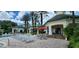 Pool deck with lounge chairs and clubhouse view at 8910 Legacy Ct # 206, Kissimmee, FL 34747