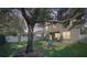 Spacious backyard with a large tree and grassy area at 9026 Dry Creek Ln, Orlando, FL 32832