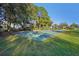 Outdoor basketball court nestled in a community with mature trees and homes at 9026 Dry Creek Ln, Orlando, FL 32832