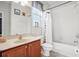 Clean bathroom with tub shower combo, wood vanity, and neutral color scheme at 9026 Dry Creek Ln, Orlando, FL 32832