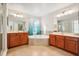 Large Primary bathroom with double vanities, corner soaking tub, and separate shower at 9026 Dry Creek Ln, Orlando, FL 32832