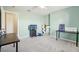 Bedroom with two desks, TV, and window at 9026 Dry Creek Ln, Orlando, FL 32832