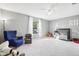 Spacious bedroom with armchair and crib at 9026 Dry Creek Ln, Orlando, FL 32832