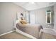 Cozy bedroom with a full-size bed and wall-mounted TV at 9026 Dry Creek Ln, Orlando, FL 32832