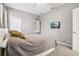 Bright bedroom with a full-size bed and plenty of natural light at 9026 Dry Creek Ln, Orlando, FL 32832