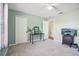Light green bedroom with a closet and desk at 9026 Dry Creek Ln, Orlando, FL 32832
