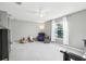 Bright bedroom with armchair and window at 9026 Dry Creek Ln, Orlando, FL 32832