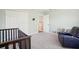 Cozy bedroom with a built in crib and recliner at 9026 Dry Creek Ln, Orlando, FL 32832