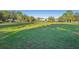 Spacious grassy park with playground and basketball courts at 9026 Dry Creek Ln, Orlando, FL 32832