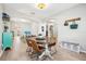 Bright dining room with hardwood floors and a charming wooden table at 9026 Dry Creek Ln, Orlando, FL 32832