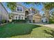 Two-story house with landscaping and a brick driveway at 9026 Dry Creek Ln, Orlando, FL 32832