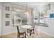 Cozy kitchen nook with a white table and two chairs at 9026 Dry Creek Ln, Orlando, FL 32832