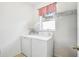 Laundry room with washer, dryer, and window at 9026 Dry Creek Ln, Orlando, FL 32832