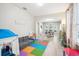 Open living area with dining table and play area at 9026 Dry Creek Ln, Orlando, FL 32832
