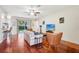 Living area with hardwood floors, a sofa, and access to the backyard at 9026 Dry Creek Ln, Orlando, FL 32832