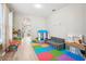 Playroom with colorful mats and ' furniture at 9026 Dry Creek Ln, Orlando, FL 32832