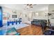 Playroom with hardwood floors, built in storage and a comfy couch at 9026 Dry Creek Ln, Orlando, FL 32832