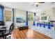 Spacious playroom with hardwood floors, large windows, and built-in storage at 9026 Dry Creek Ln, Orlando, FL 32832