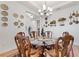 Charming dining room with unique wall decor and glass-top table at 972 Ladera Ranch Rd, Kissimmee, FL 34759