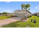 House front view, two-car garage, and nicely landscaped at 972 Ladera Ranch Rd, Kissimmee, FL 34759