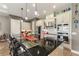 Modern kitchen with granite countertops, custom cabinetry, and island seating at 972 Ladera Ranch Rd, Kissimmee, FL 34759