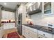 Modern kitchen with stainless steel appliances and granite countertops at 972 Ladera Ranch Rd, Kissimmee, FL 34759