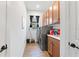 Convenient laundry room with washer, dryer, and ample storage at 972 Ladera Ranch Rd, Kissimmee, FL 34759