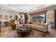 Bright living room with large windows, ample seating, and decorative accents at 972 Ladera Ranch Rd, Kissimmee, FL 34759