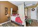 Relaxing main bedroom with a four-poster bed and ensuite bath access at 972 Ladera Ranch Rd, Kissimmee, FL 34759