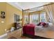 Spacious main bedroom with a four-poster bed and large windows at 972 Ladera Ranch Rd, Kissimmee, FL 34759