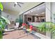 Inviting outdoor patio with seating area and built-in grill at 972 Ladera Ranch Rd, Kissimmee, FL 34759