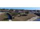 Aerial view of house and backyard with pond at 102 Lake Tracy Ct, Haines City, FL 33844
